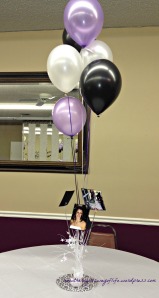 These balloon centerpieces were on each table. Within each centerpiece were photos of Jaymee at each of her birthdays from 1st to 15th as well as photos of her throughout the years. 